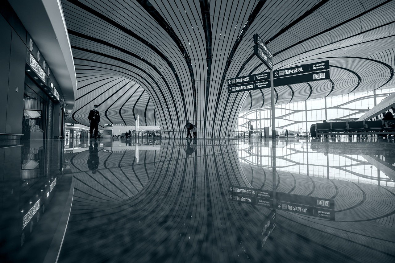 What problems does a traveler face when they're stuck at the airport without a hotel room?